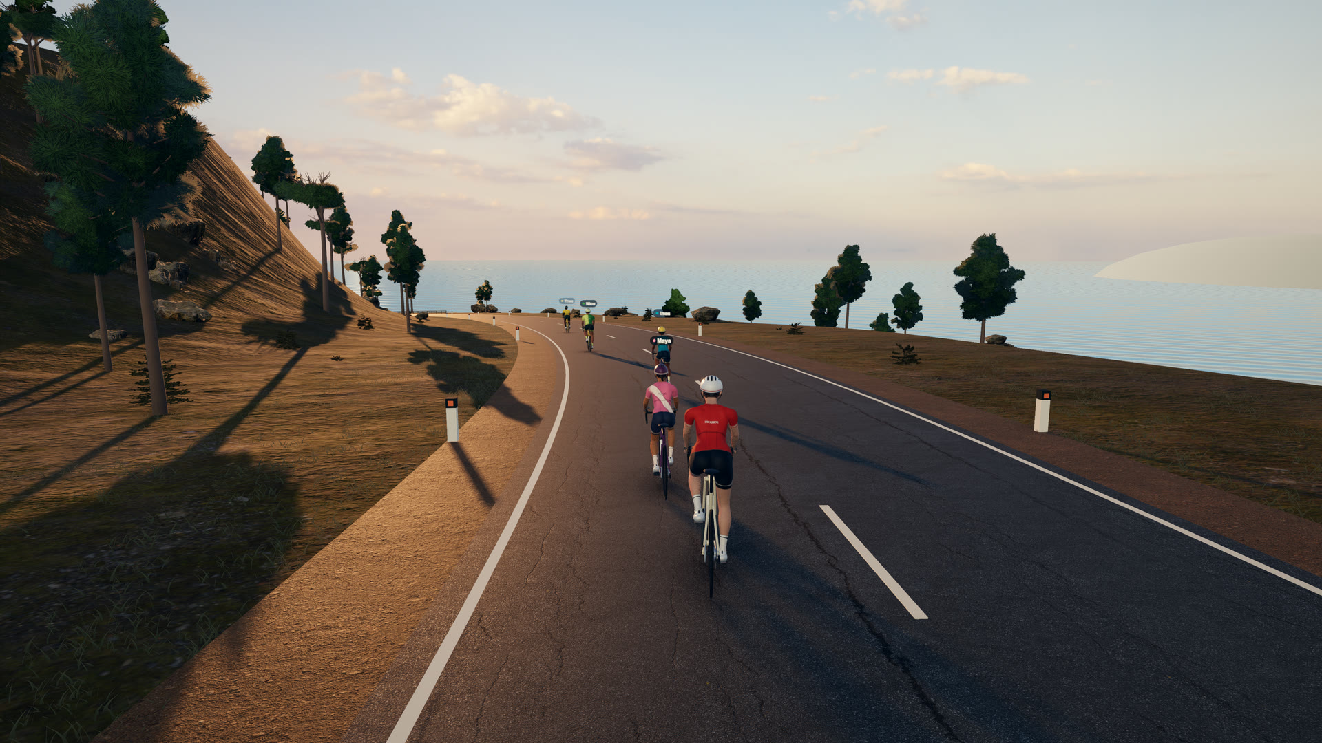 Fikaride gameplay on Coast Loop at golden hour: a rider on a coast road beside the sea, with computer pacers ahead.